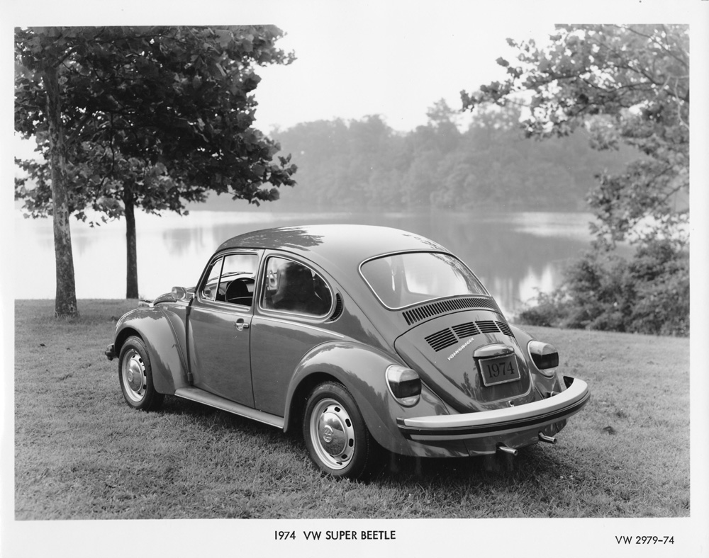 Volkswagen promo picture of a 1974 Super Beetle model 1303. This model introduced a curved windshield for better visibility and a redesigned front suspension compared to standard Beetles. Features distinctive "elephant foot" taillights introduced in 1973.