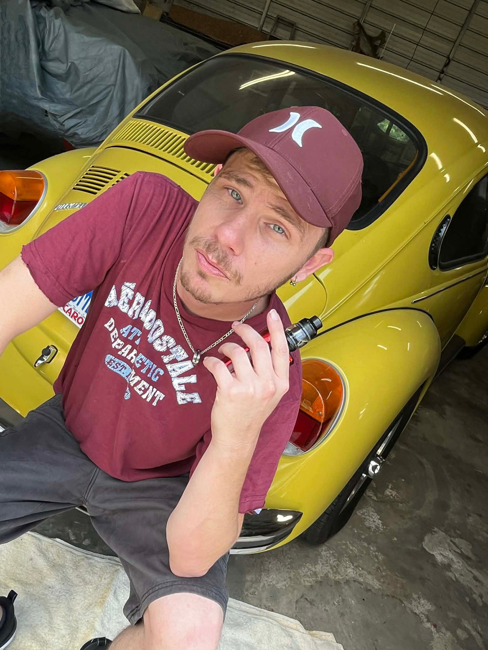 1303 Super Beetle with the owner on the bumper