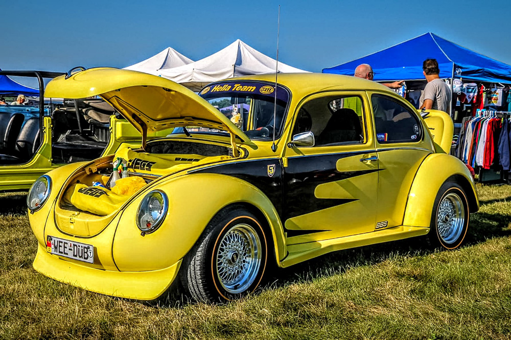 Custom 1973 Super Beetle in bright yellow with a Creative Car Craft wide body kit