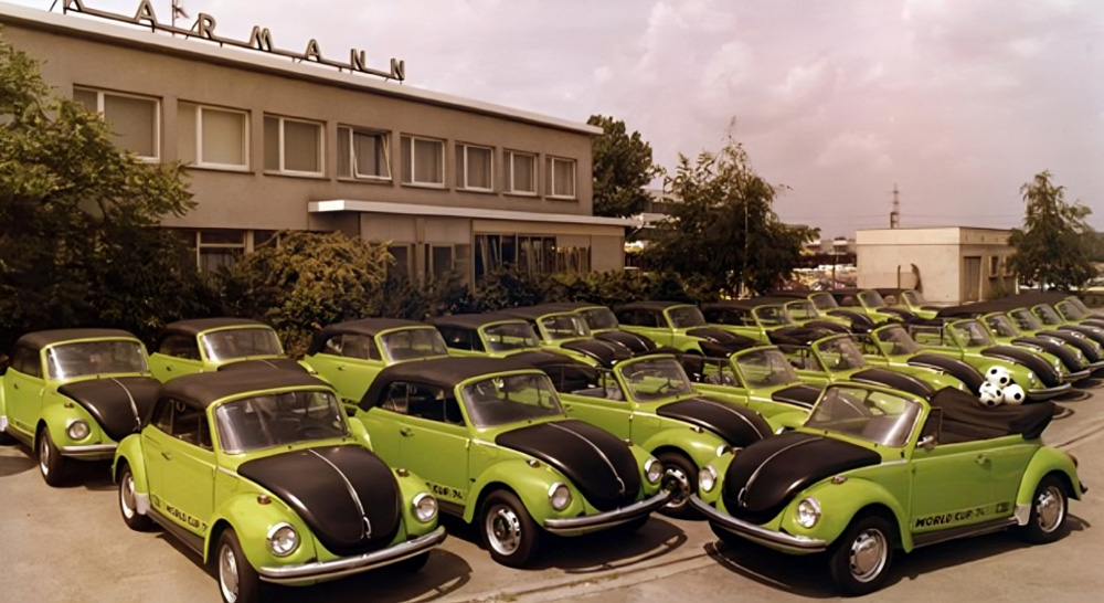 Rows of green World Cup 74 Super Beetle convertibles parked outside the Karmann factory in Osnabr&uuml;ck.