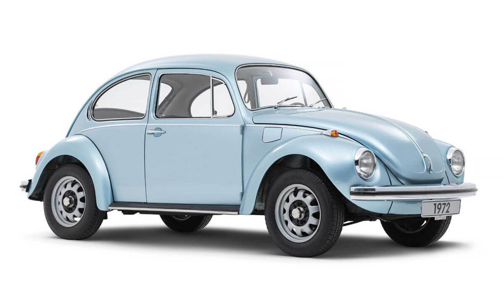 Light blue Volkswagen Marathon Beetle with a 1972 plate parked outdoors.