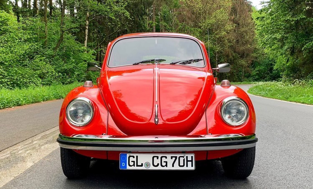 Red Super Beetle on a road