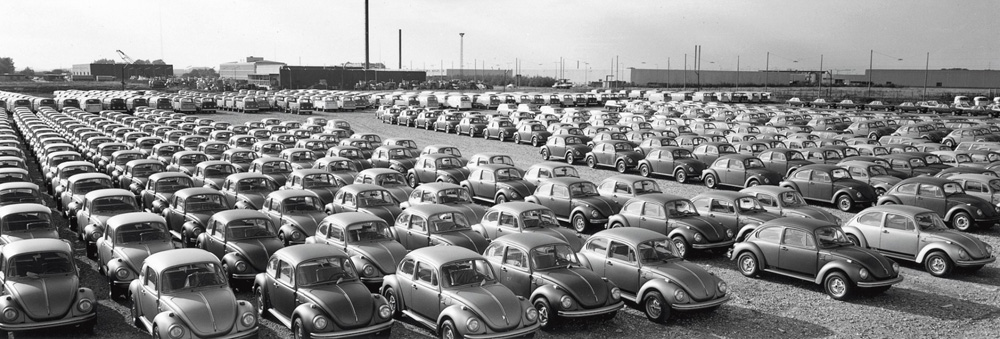 a storage yard of new Volkswagens somewhere in Denmark with a large consignment of 1974 model year
