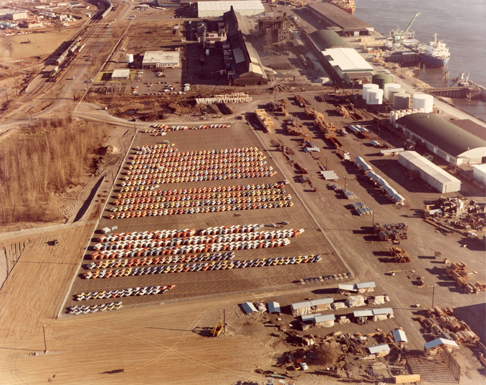 1972 Volkswagens in bright colours are neatly lined up at the port of Vancouver, Washington