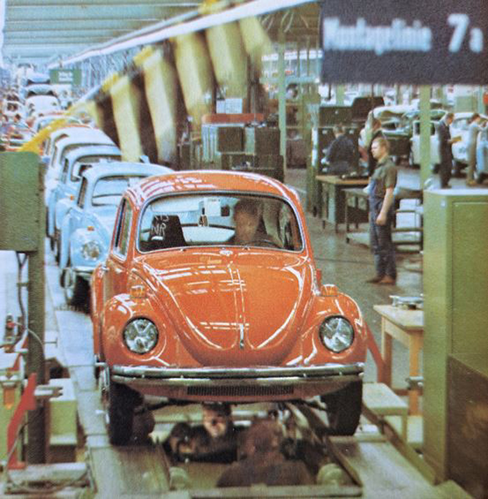 A USA specification 1971 1302 Super Beetle in Clementine Orange getting an alignment near the end of the assembly line at Wolfsburg