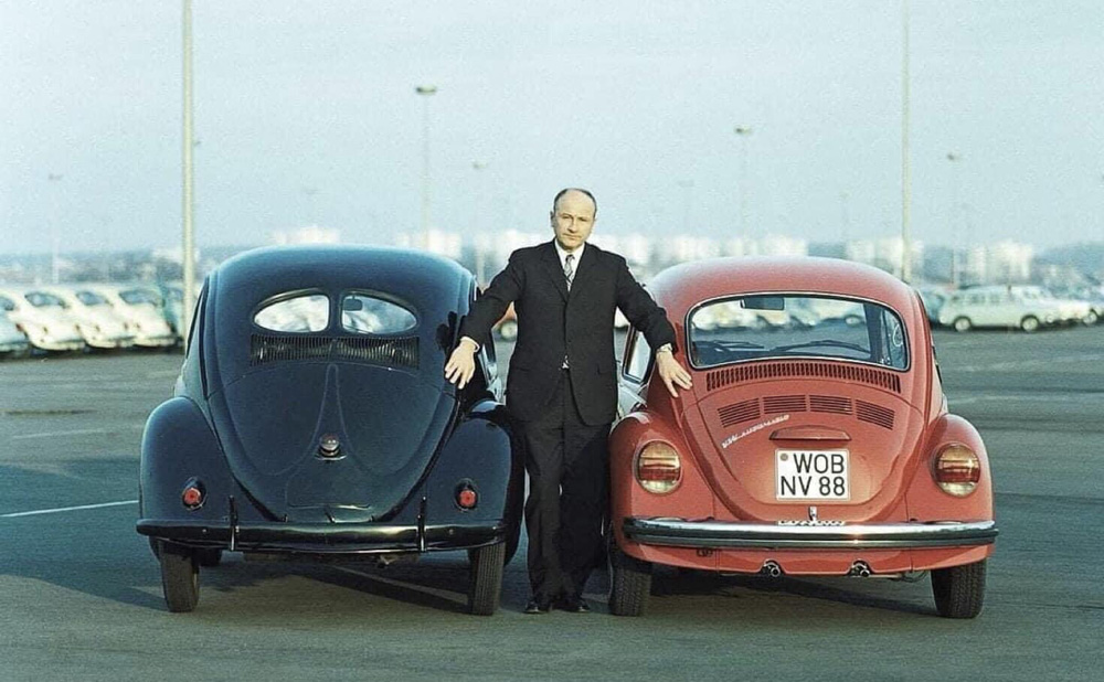 Professor Dr. Ernst Fiala, photographed on site at Volkswagenwerk Wolfsburg with the Split Window and Super Beetle
