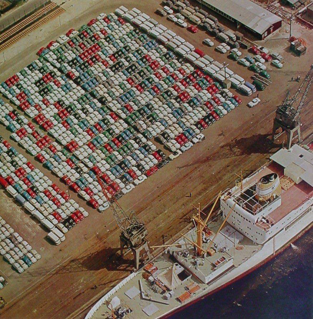 Hundreds of Beetles, a few dozens Transporters, and a handful of Karmann Ghias in this aerial photo of the port of Hamburg